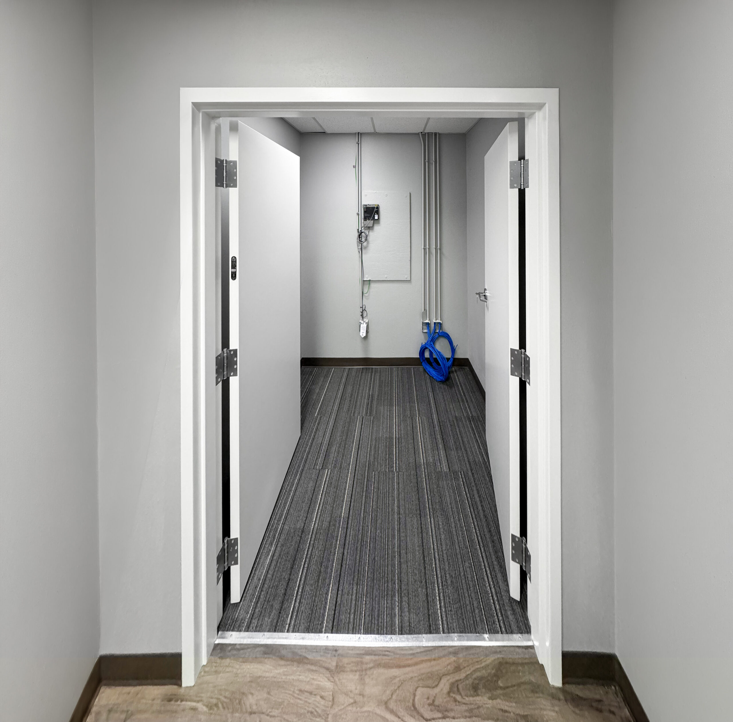 Financial Institution -- IT infrastructure closet with conduit and panel